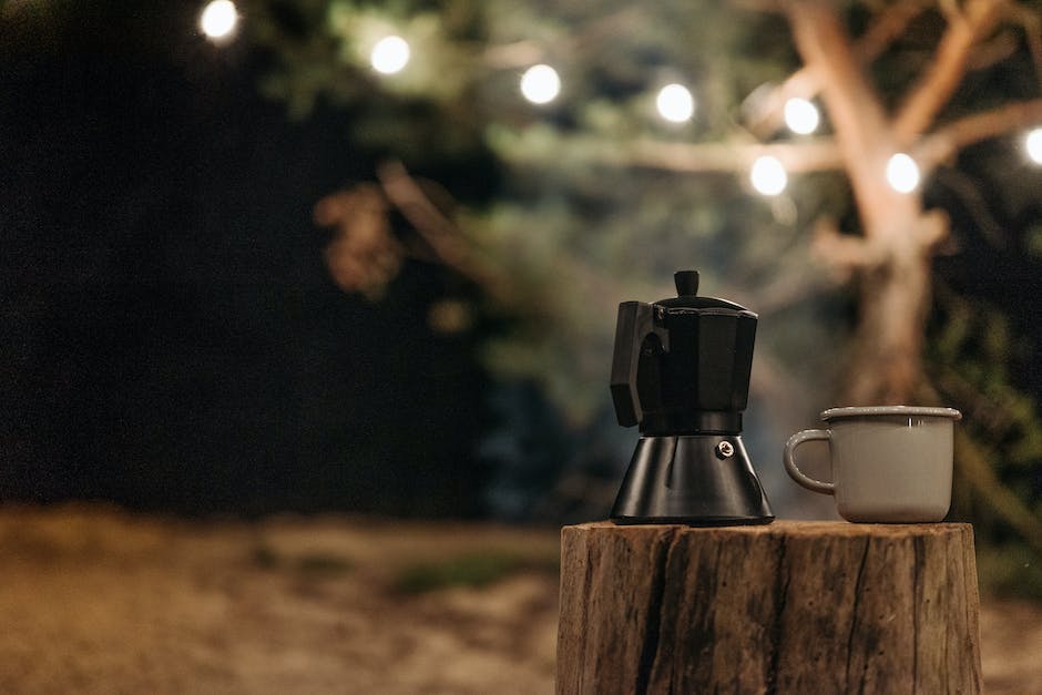 Image of a Moka Pot on a stove, brewing coffee.